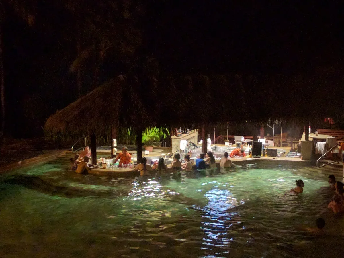 Swim-up bar in a steaming thermal pool at Tabacon hot springs near Arenal volcano, Costa Rica