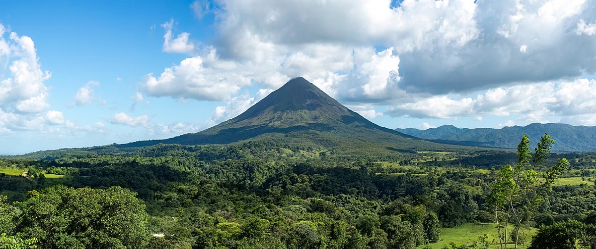 The Arenal volcano cone clearing the rainforest near the arenal manoa hot springs area of Costa Rica